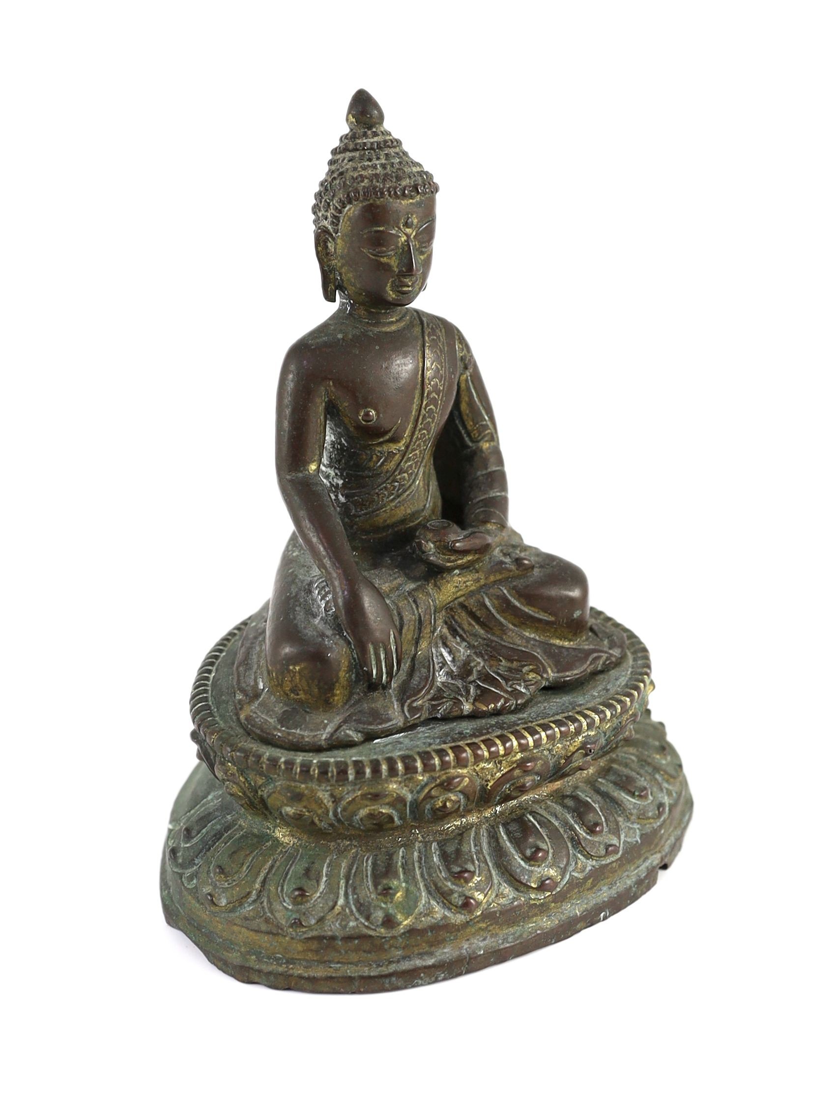 A Nepalese or Tibetan gilt copper alloy figure of Buddha Shakyamuni, 18th/19th century, 15cm high